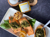 |Pan-Roasted-Trout|A girl with long brown curly hair holds an open bottle of Clif Family Rte Blanc Sauvignon Blanc in one hand and a stemless glass of wine in the other.
