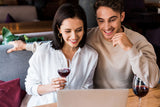 |Corporate-Virtual-Wine-Tasting|Woman at laptop with a glass of Clif wine