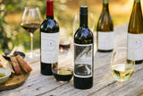 Clif Family's The Climber Bordeaux-style Red Blend||Ron and Gary Climbing|The Climber Label|||||||A bottle of Clif Family's The Climber Red Blend sits on a rock with a stainless steel wine tumbler and some rock climbing rope behind the bottle.