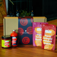 CEF Family brand products including a box, jars, and bags on a wooden surface.
